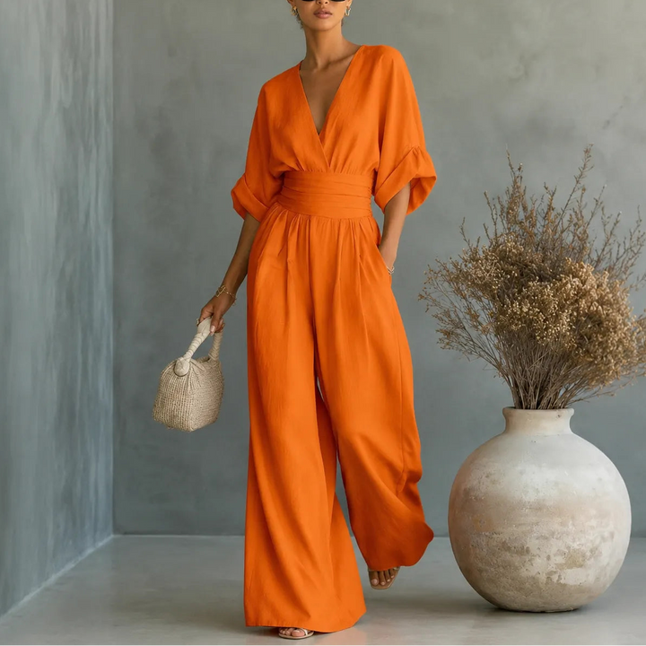 Soléra – Wide Leg V Neck Jumpsuit with Pleated Waist Sash