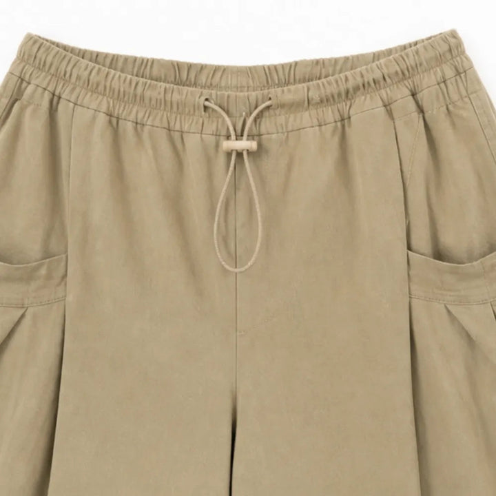 Lorenza – Pleated Wide-Leg Lantern Trousers with Drawstring Waist and Deep Pockets