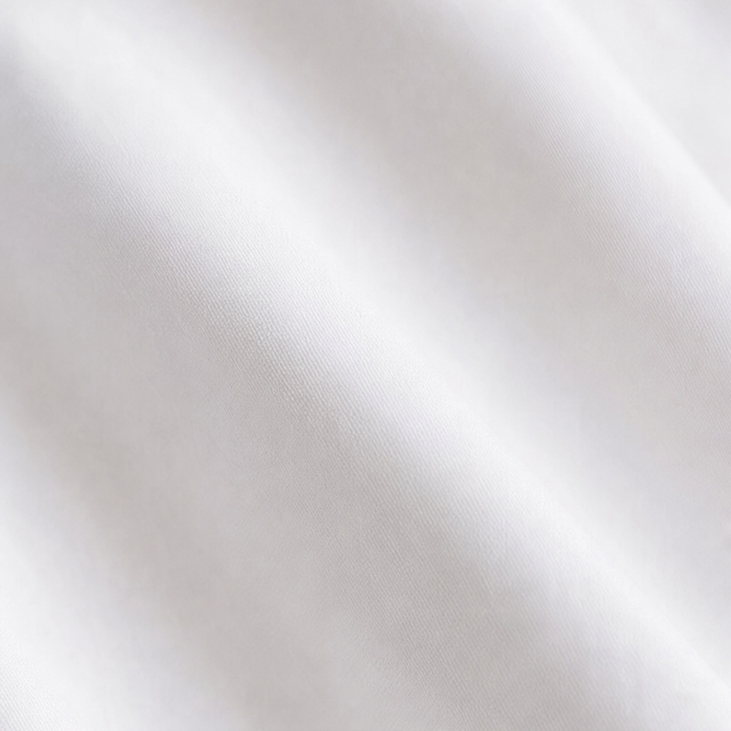 Vela Twist – Diagonal Wrap Hem Cotton Shirt
