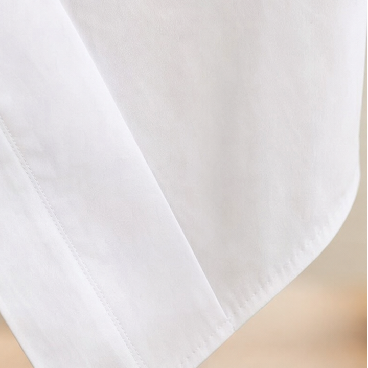 Vela Twist – Diagonal Wrap Hem Cotton Shirt