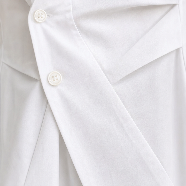 Vela Twist – Diagonal Wrap Hem Cotton Shirt