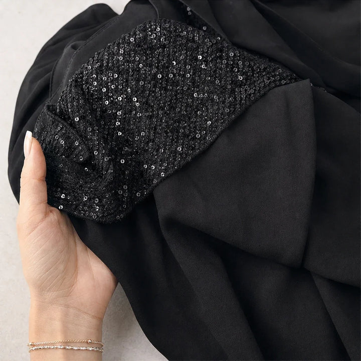 Vellora – Sequin Ruffle V-Neck Blouse