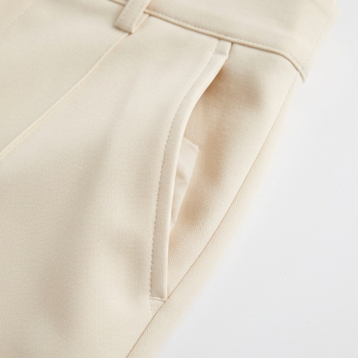 Veloura – High-Waisted Pleated Stretch Trousers