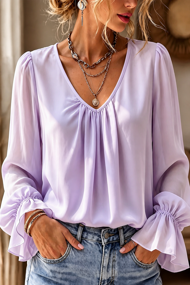 Pleatrelle – V-Neck Pleated Blouse With Ruffled Cuffs